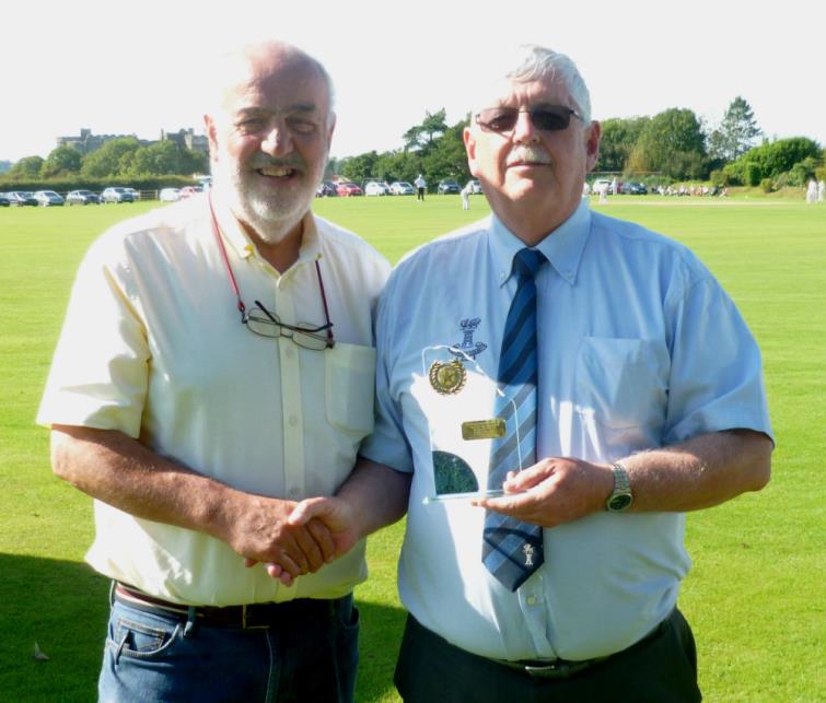 Bill Carnes presents Trefor Evans with the Star of the Month Award for August